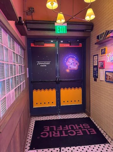 Door vinyl graphics installed for an event venue entry.