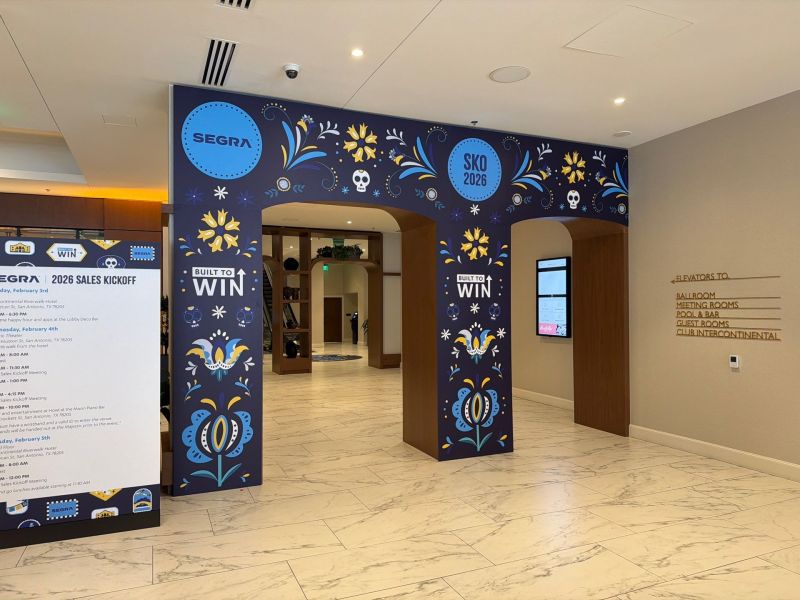 Branded entrance arch graphics for a hotel sales kickoff event.