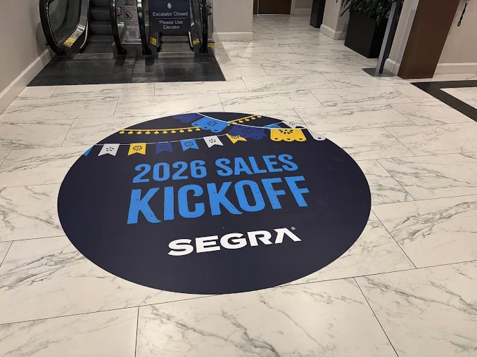 Circular floor graphic installed in Austin for a sales kickoff event
