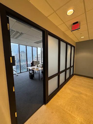 Frosted privacy film installed on office interior glass.