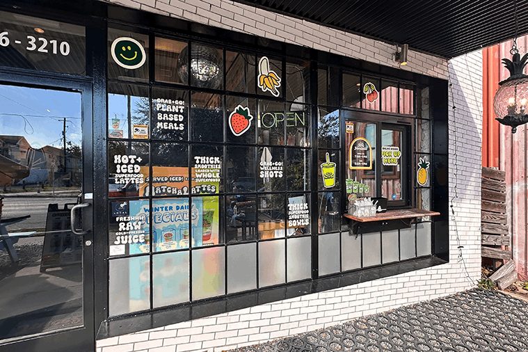 Restaurant window graphics and decals on storefront glass.