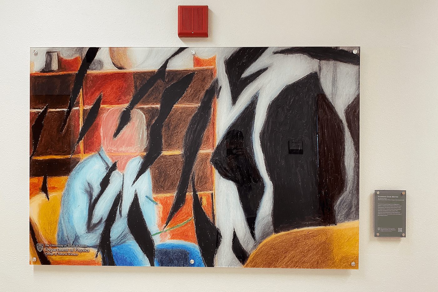 Mounted acrylic wall display with printed art and standoff hardware.