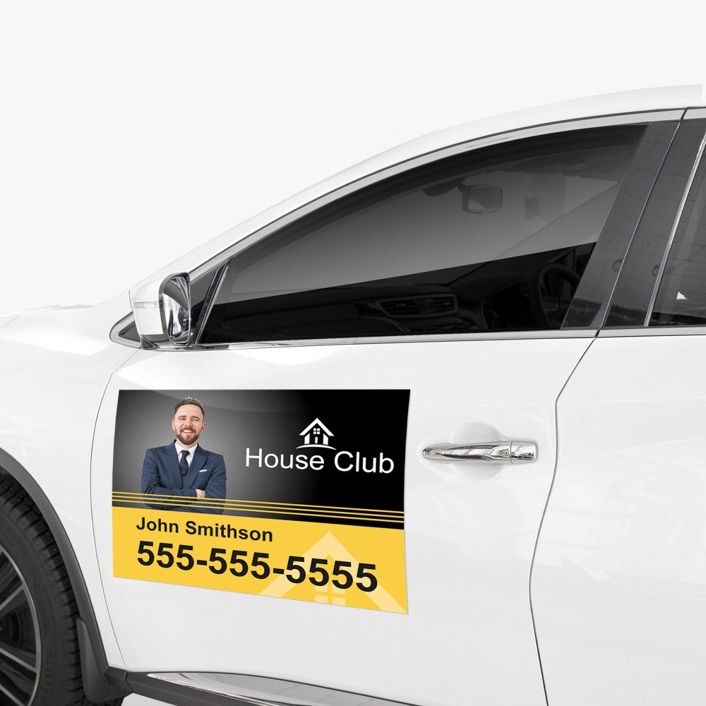 Printed magnetic vehicle sign on a white vehicle door.